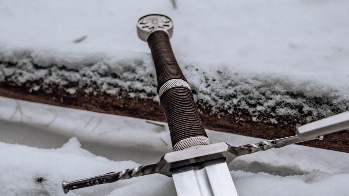 The sins of David. Sword hilt lying on a snowy branch.